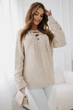 Beige knotted V-neck sweater