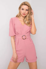 Old pink playsuit adorned with a tone-on-tone belt