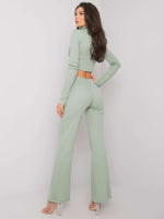 Light green two-piece set with collared bust and shoulder pads and flared pants