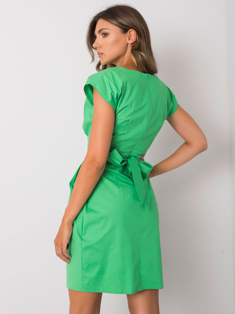 Short puffy green dress with side pockets and a tie belt